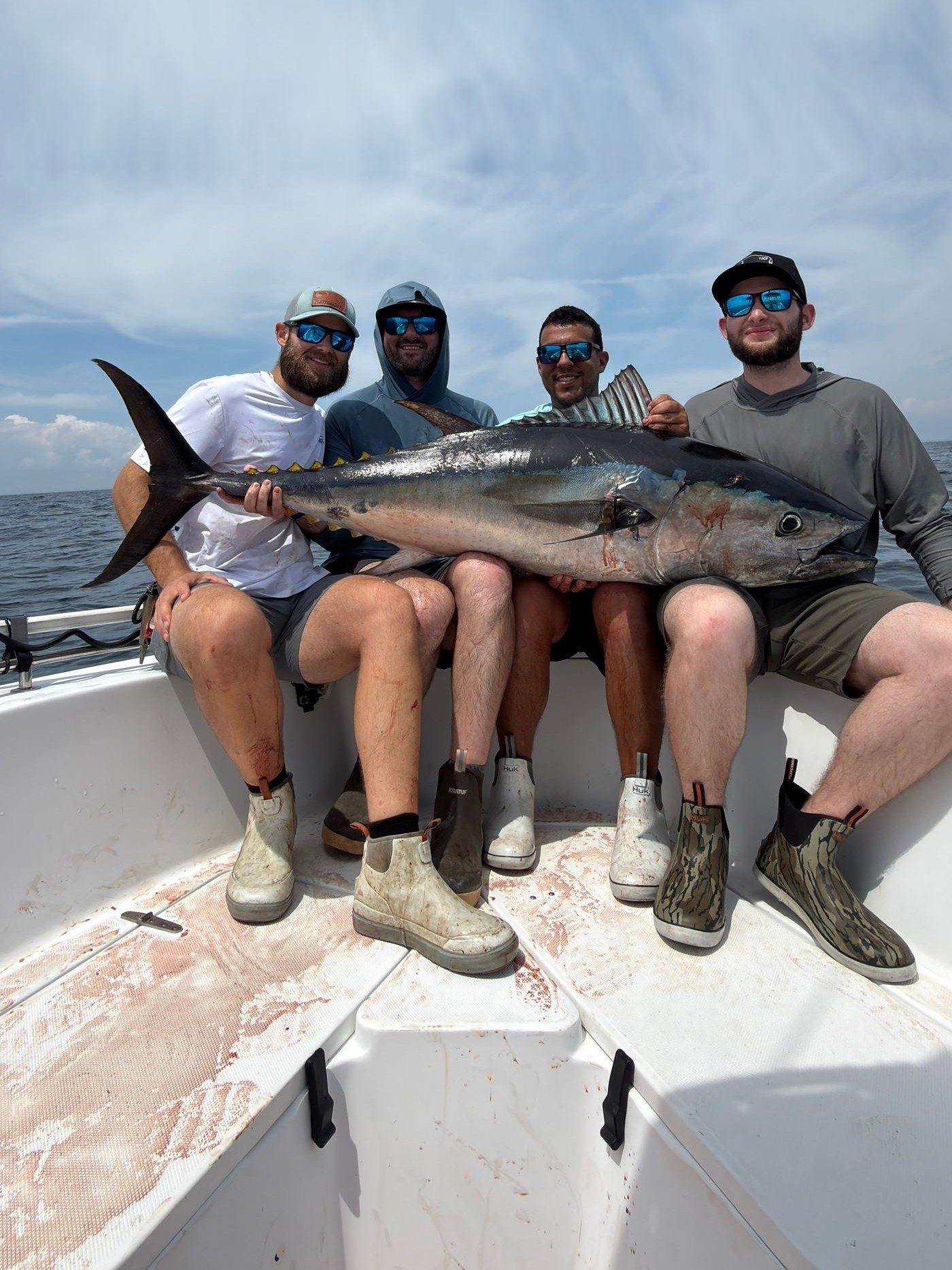 Eric and the crew with a big bluefin tuna caught offshore of Long Island, NY
